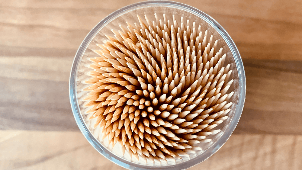 wood toothpicks in a cup